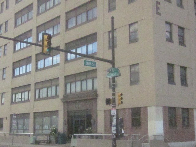 Street signs at 30th and Walnut Streets